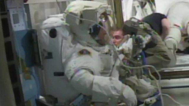 Tim Peake in his spacesuit ready to go in to the spacelock