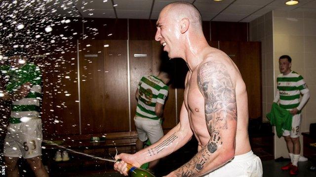 Celtic captain Scott Brown celebrates winning the Premiership