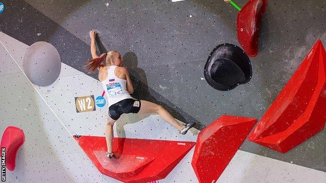 Janja Garnbret on the boulder wall at the Climbing World Cup