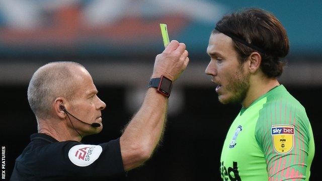 Chris Maxwell receives his second yellow card of the afternoon and is sent off by referee Andy Woolmer