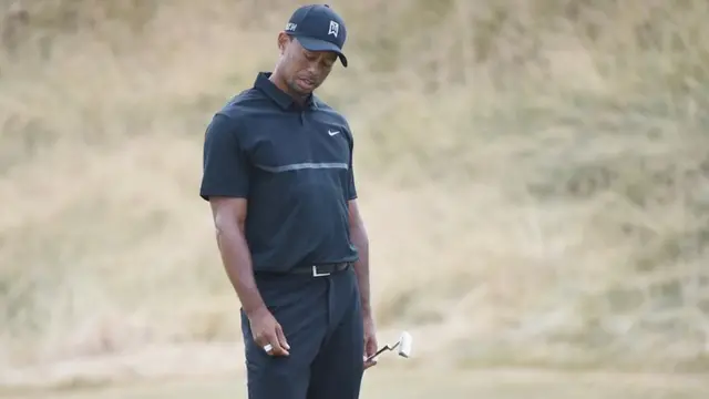 Tiger Woods looks dejected