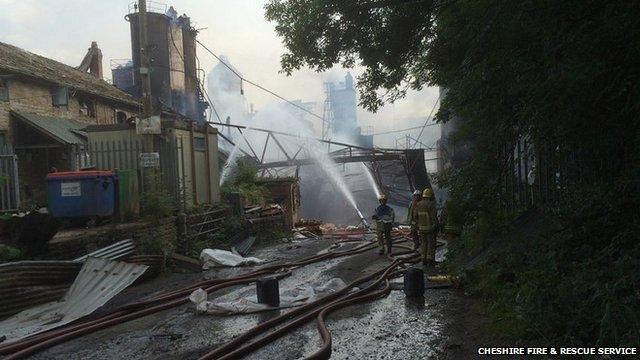 Fire crews damping down the site