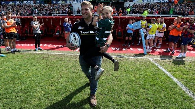 Tom Youngs carrying his daughter Maisie