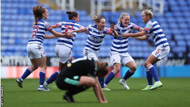 Reading's players celebrate scoring against Leicester