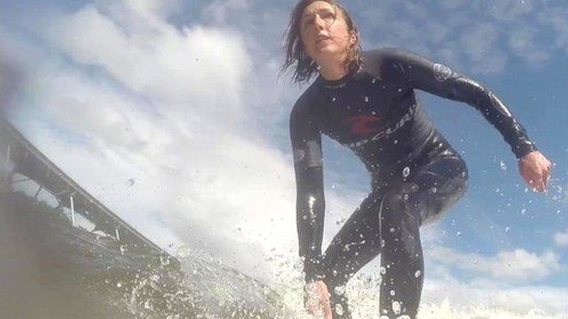 Claire Marshall surfing