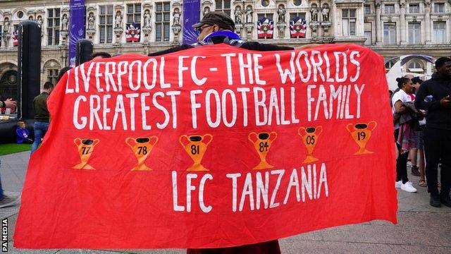 A Liverpool fan shows his support in Paris before the 2022 Champions League final