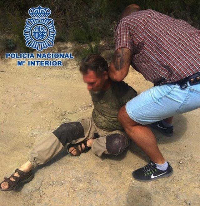 A close-up picture of Jos Brech's arrest by Spanish police