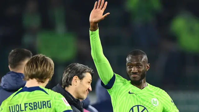 Josuha Guilavogui waves to fans while with Wolfsburg