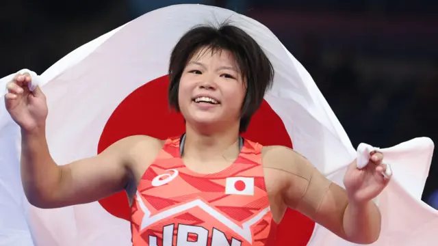 Tsugumi Sakurai celebrates winning gold at the Paris 2024 Olympics