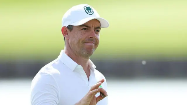 Rory McIlroy acknowledges the crowd during his second round at Le Golf National