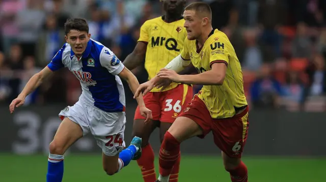 Mattie Pollock brings the ball forward for Watford 