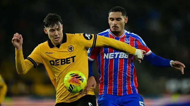 Jorgen Strand Larsen battles for possession with Crystal Palace's Maxence Lacroix