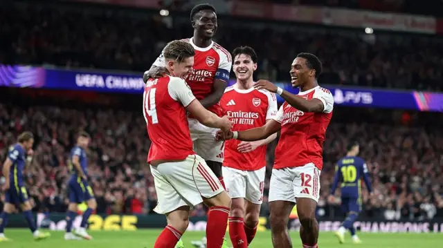 Viktor Gyoekeres celebrates with Bukayo Saka and Jurrien Timber 