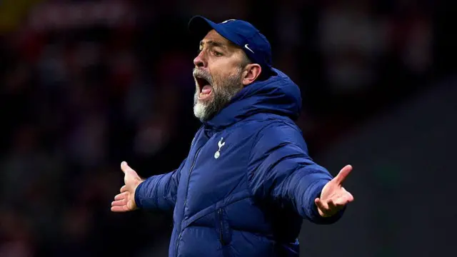 Igor Tudor stands with his arms outstretched