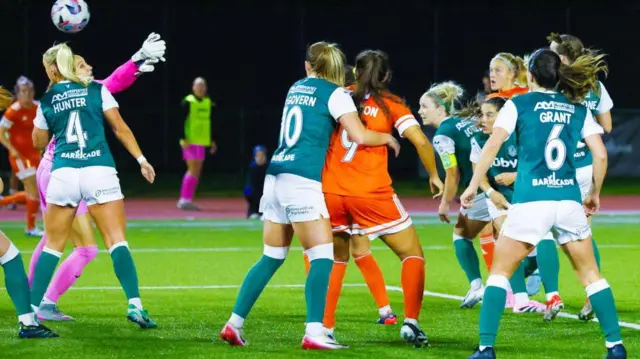 Glasgow City's Katie Lockwood (right) scores against Hibs