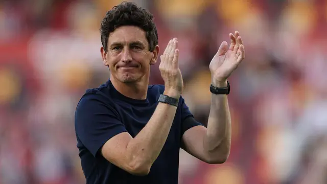 Brentford's Irish head coach Keith Andrews applauds the fans following the English Premier League football match between Brentford and Tottenham Hotspur at the Gtech Community Stadium in London.