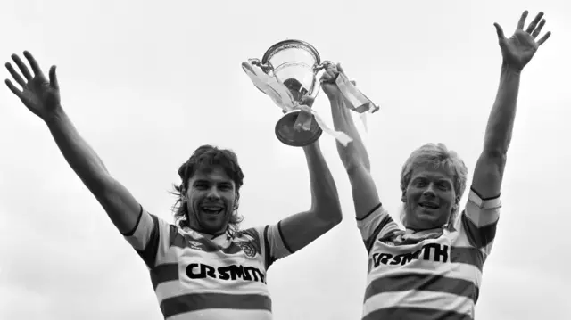 Brian McClair and Maurice Johnston celebrate lifting the league title. 