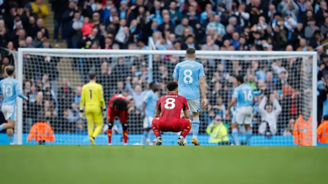 A dejected Joao Gomes of Wolverhampton Wanderers reacts after Julian Alvarez of Manchester City scored a goal to make it 5-1 