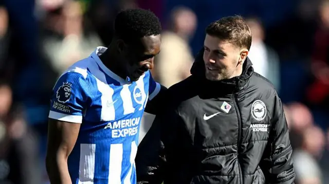 Danny Welbeck of Brighton & Hove Albion embraces Fabian Huerzeler, Manager of Brighton & Hove Albion