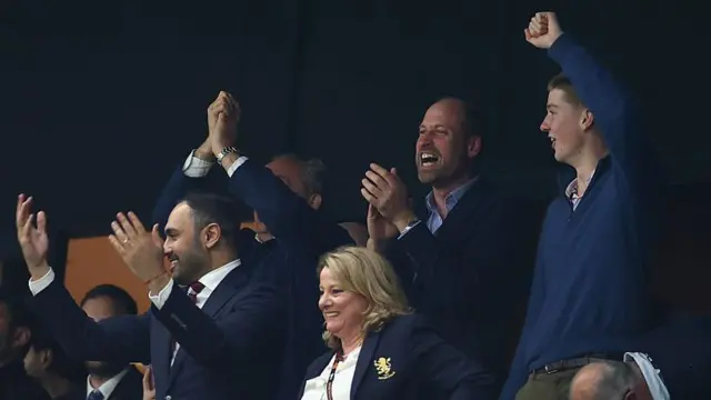 Prince of Wales celebrates in the stands
