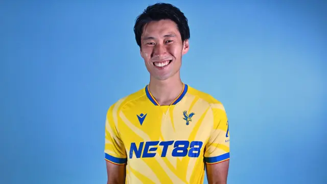 Daichi Kamada models new Palace away kit