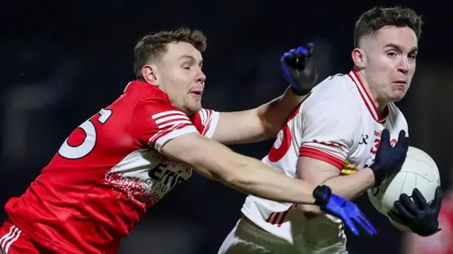 Eoin McElholm (right) is challenged by Derry's Cormac Murphy in the Allianz Football League Division One game in late January