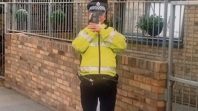 Cardboard cut-out police officer