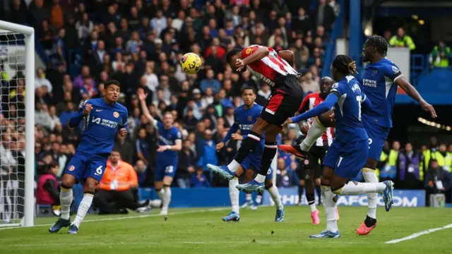 Ethan Pinnock scores Brentford's first goal during the Premier League match at Chelsea last season