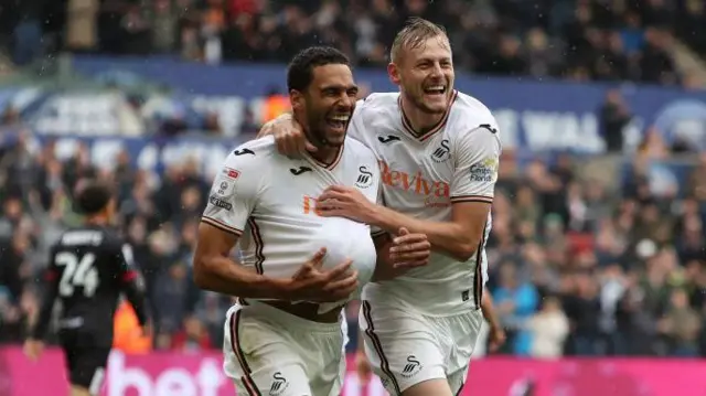 Ben Cabango and Harry Darling celebrate