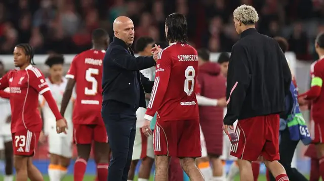  Arne Slot, Manager of Liverpool, interacts with Dominik Szoboszlai of Liverpool
