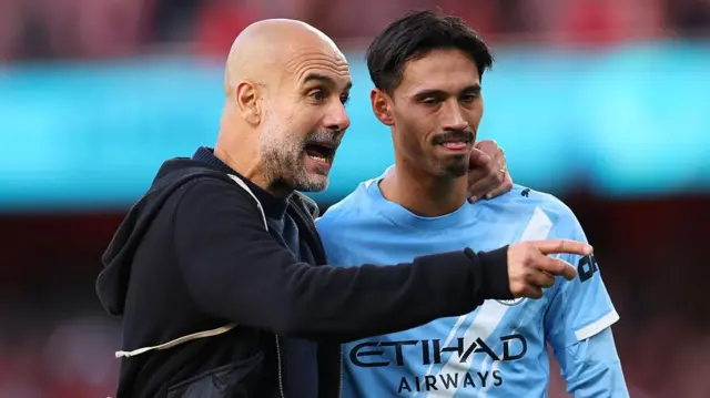 Pep Guardiola and Tijjani Reijnders