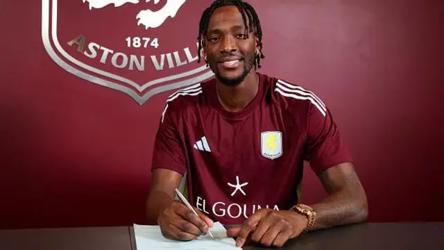 Tammy Abraham poses for a picture in Aston Villa colours
