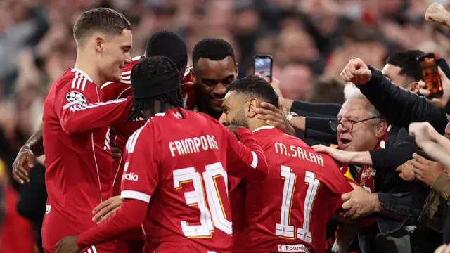 Mohamed Salah of Liverpool celebrates with teammates after scoring
