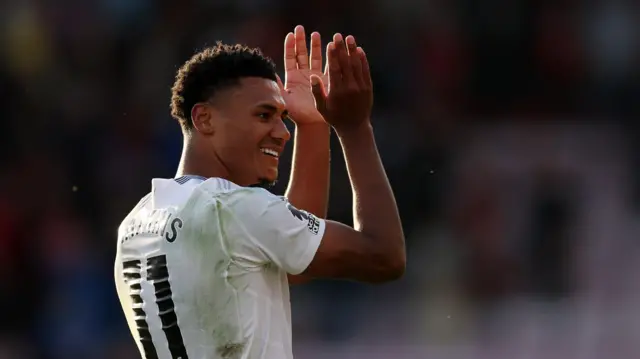 Ollie Watkins applauds fans after match