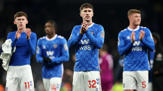  Trai Hume of Sunderland applauds the fans 