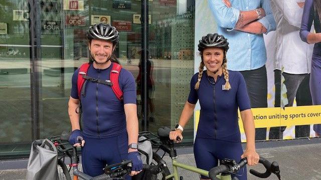 Dave Cheeseman and Sarah Dawkins prepare to Pedal to Paris outside the BBC Sport office