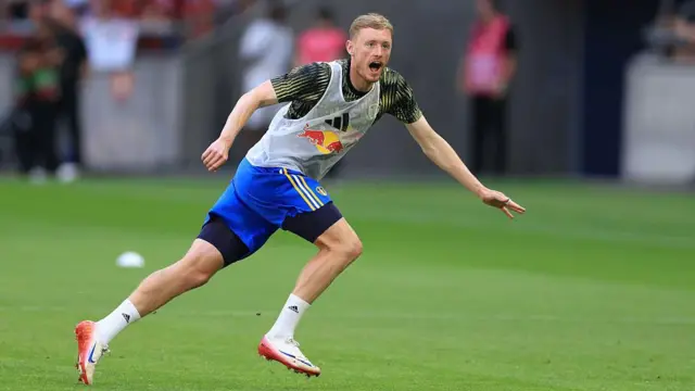 New Leeds United signing Sean Longstaff warms up before Saturday's pre-season friendly against Manchester United