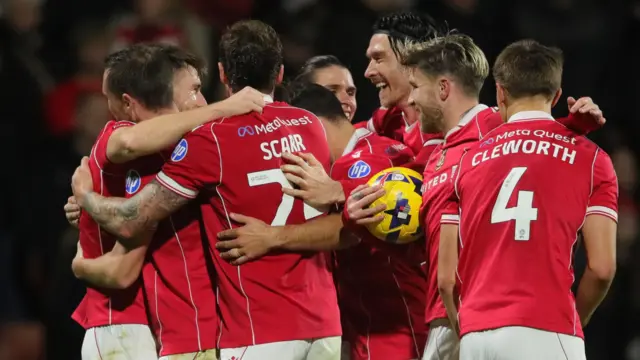 Wrexham players celebrate a George Thomason goal earlier this season 