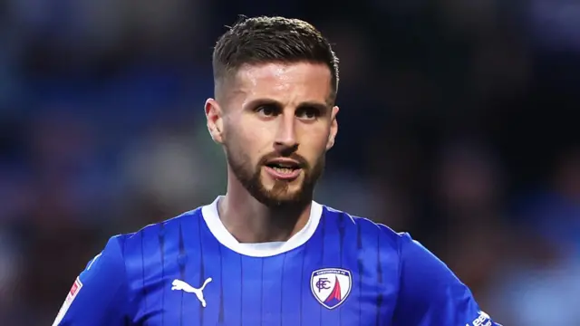 Ryan Colclough in a blue Chesterfield home jersey during a match