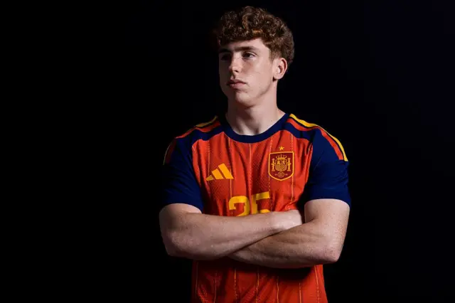 Victor Munoz poses in his Spain shirt
