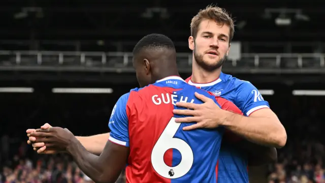 Joachim Andersen embraces fellow Crystal Palace centre-back Marc Guehi