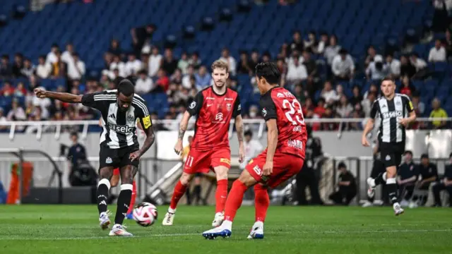 Alexander Isak of Newcastle United scores the opening goal