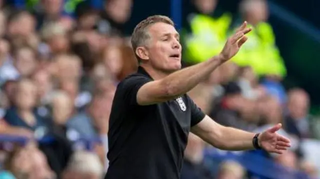 Phil Parkinson gives instructions to his players from the touchline