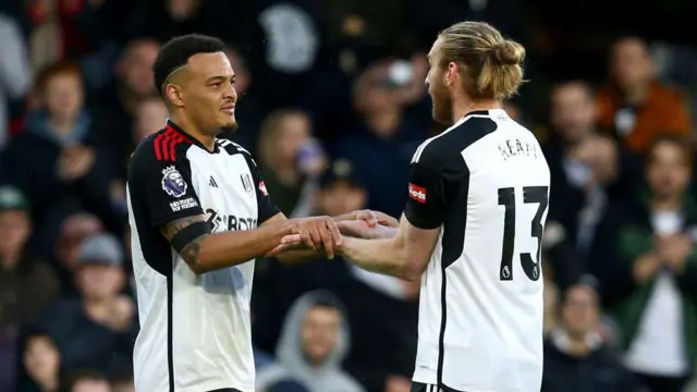 Rodrigo Muniz of Fulham celebrates scoring his team's third goal with teammate Tim Ream of Fulham during the Premier League match between Fulham FC and AFC Bournemouth at Craven Cottage