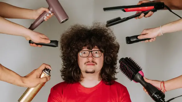 Frank Ilett poses with hair tools