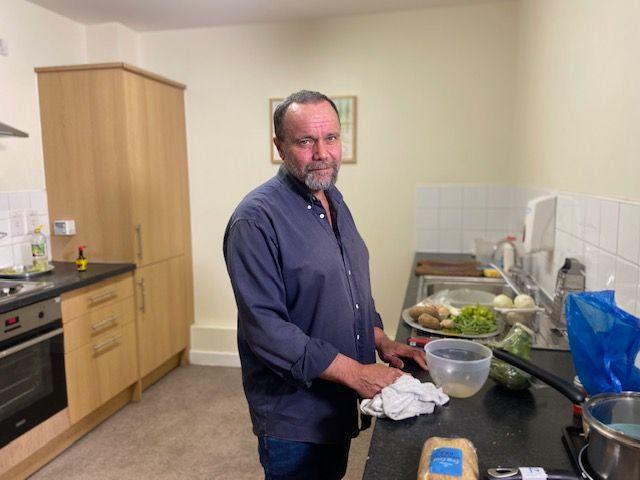 Chef Stephen Richards standing in St Mungo's kitchen