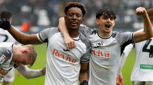 Jamal Lowe and Charlie Patino celebrate during Swansea's win over Cardiff