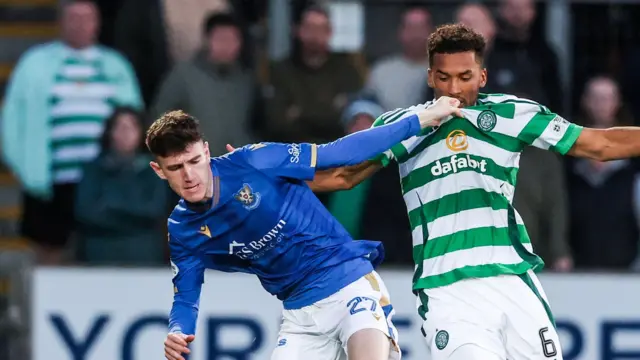 St Johnstone's Makenzie Kirk and Celtic's Auston Trusty