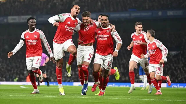 Arsenal players celebrate Ben White's goal.
