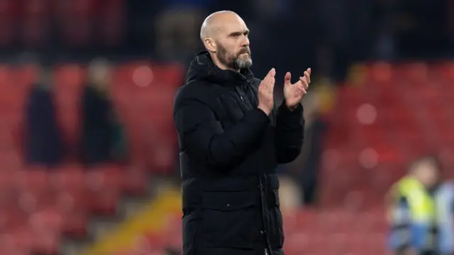 Luke Williams applauds fans at Watford